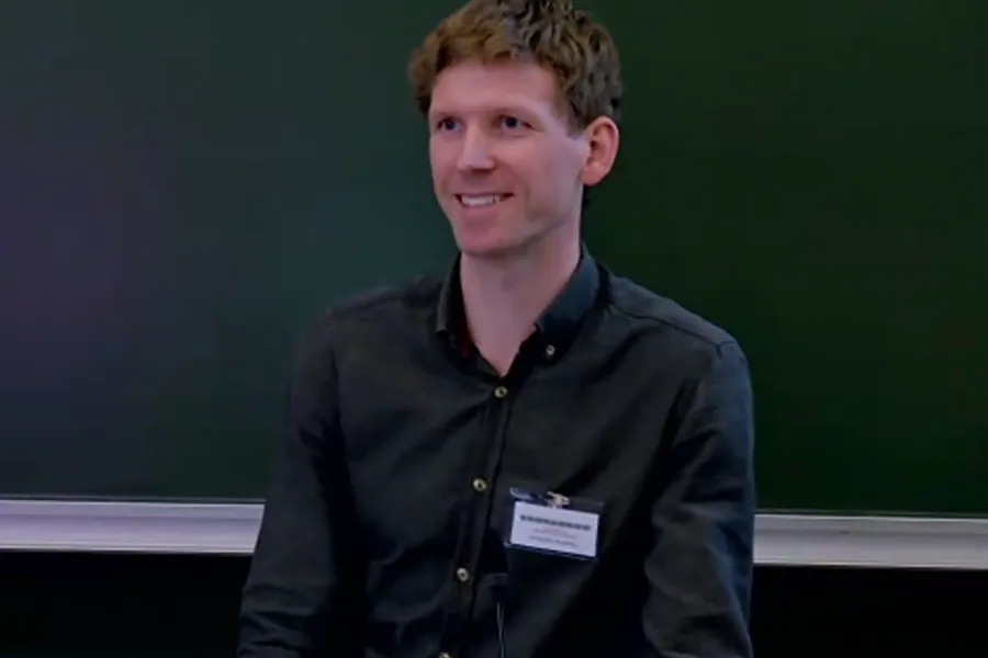 A man wearing a name tag